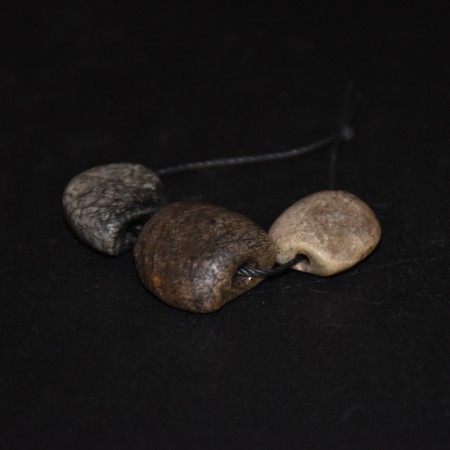 Three ancient flat neolithic feldspar beads