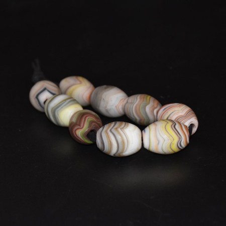 Nine large antique wound Agate Glass Beads