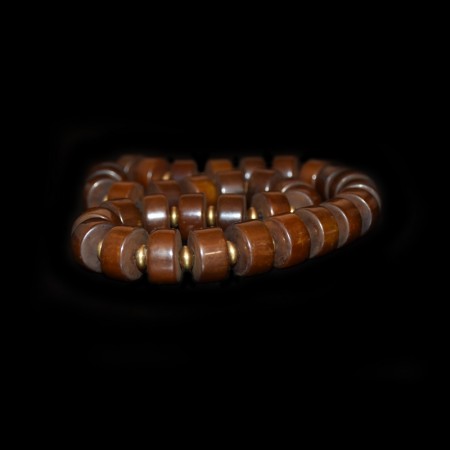 Strand with antique brown simulated amber beads