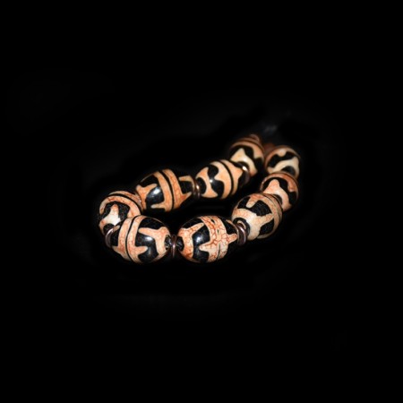 Bracelet strand with Double Tasso Dzi and Bronze Beads
