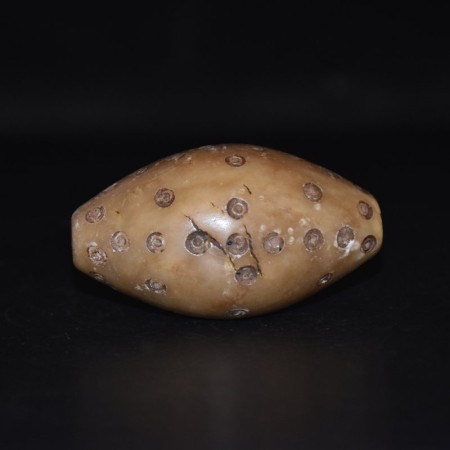 Huge ancient marble bactrian bead with decoration