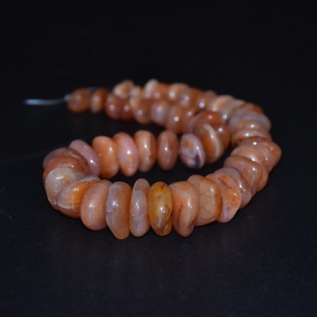 Long strand with flat antique carnelian beads