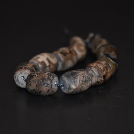 Small strand with twelve grey dzi stone beads