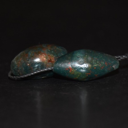 Two ancient islamic red dotted bloodstone beads