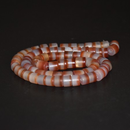 Long strand with white-red stone beads
