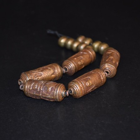 Antique tibetan copper/brass repoussee beads with animal motif