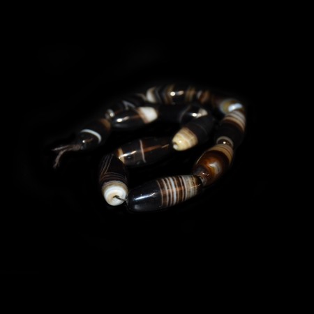 String with twelve vintage tibetan banded Agate Beads