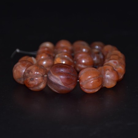 String with antique carved Carnelian Melon Beads