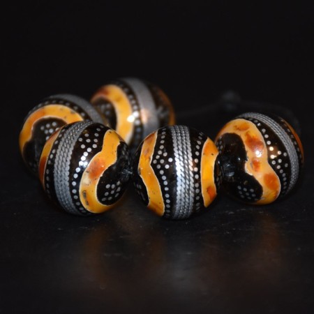 Five vintage large black coral and amber with silver inlay beads