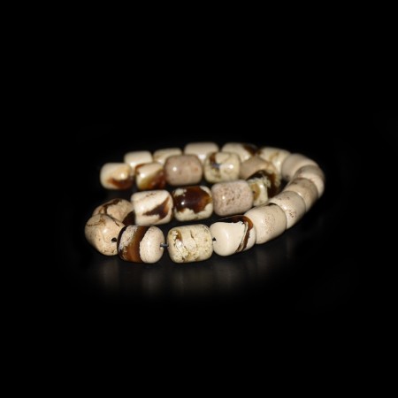Strand with white indonesian Amber Beads