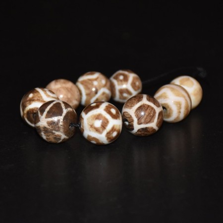 Nine round Pumtek Dzi Beads