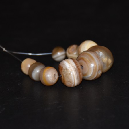 Small strand with nine ancient banded agate beads