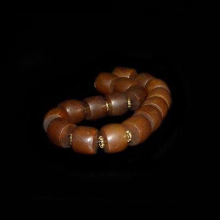 Strand of antique tibetan simulated Amber and Brass Spacer Beads