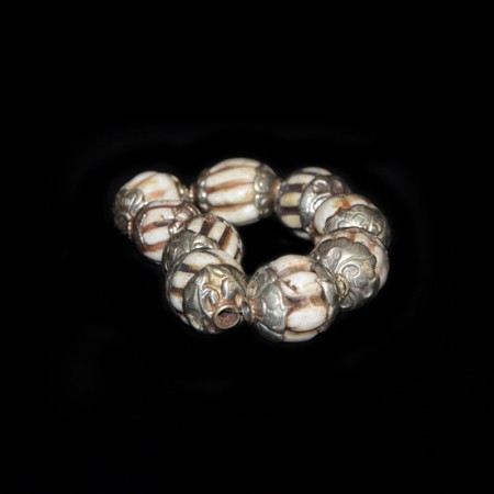 Strand with antique Silver Repoussee Conch Shell Beads