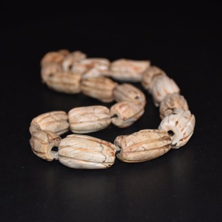 Strand with long antique tibetan melon shell beads