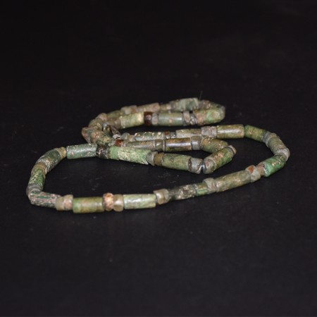 Long strand with ancient precolumbian green stone beads