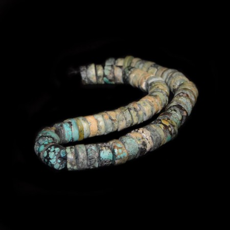 String with antique tibetan Turquoise Disc Beads
