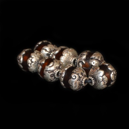 Seven silver capped Resin Beads