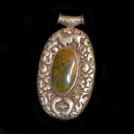 Antique tibetan Turquoise Silver Repoussee Pendant