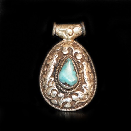 Antique tibetan Turquoise Silver Repoussee Pendant