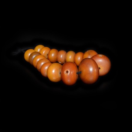 Strand with antique african simulated amber beads